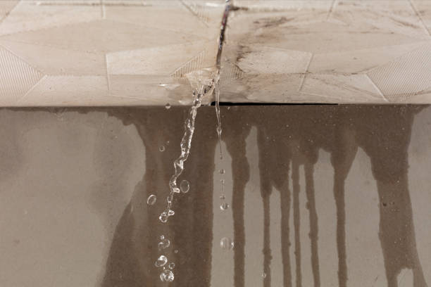 Professional Flood Damage Cleanup technician working in Amesbury, MA